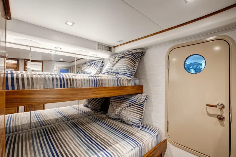 La Barca Yacht Photos Pics 2024 Viking 68 Convertible yacht cabin with bunk beds and nautical decor.