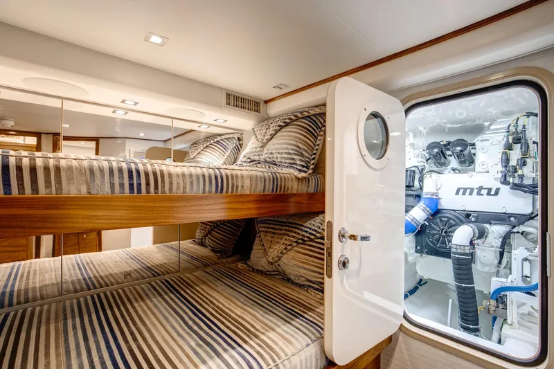 La Barca Yacht Photos Pics 2024 Viking 68 Convertible yacht interior with bunk beds and engine room view.