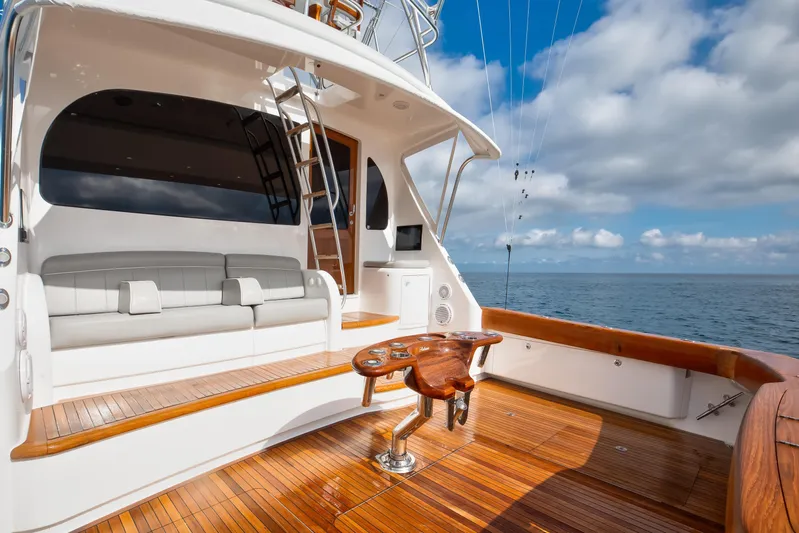 La Barca Yacht Photos Pics 2024 Viking 68 Convertible yacht deck with seating, ocean view, and fishing chair.