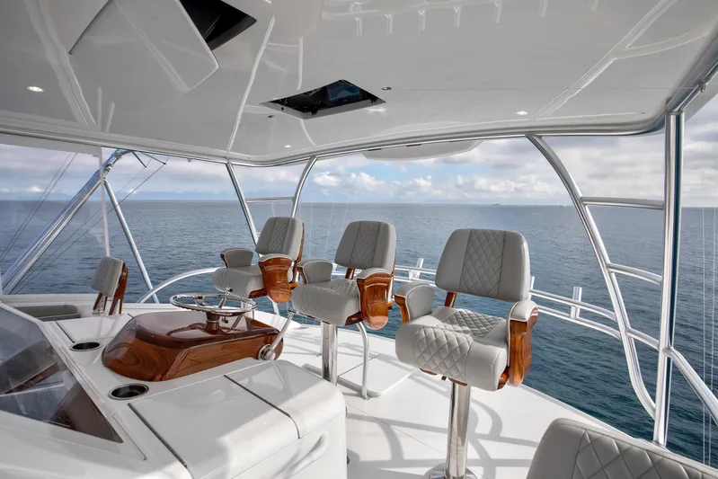 La Barca Yacht Photos Pics 2024 Viking 68 Convertible yacht helm with luxurious seating and ocean view.