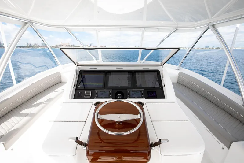 La Barca Yacht Photos Pics 2024 Viking 68 Convertible yacht helm with modern navigation system and panoramic ocean view.