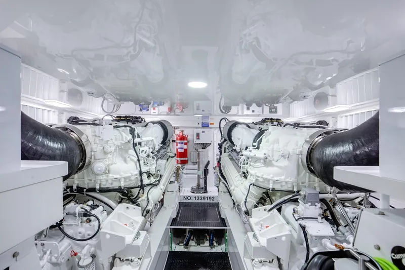 La Barca Yacht Photos Pics Engine room of 2024 Viking 68 Convertible yacht, featuring dual engines and modern equipment.