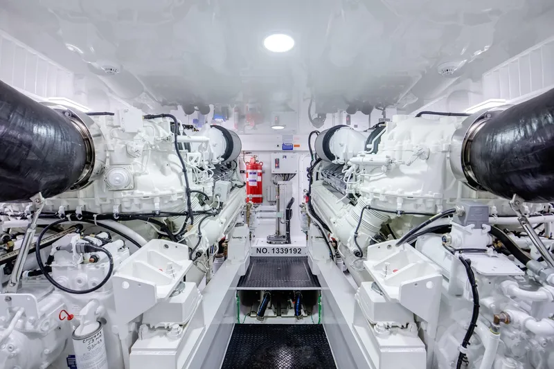 La Barca Yacht Photos Pics 2024 Viking 68 Convertible engine room with dual engines and fire extinguisher.