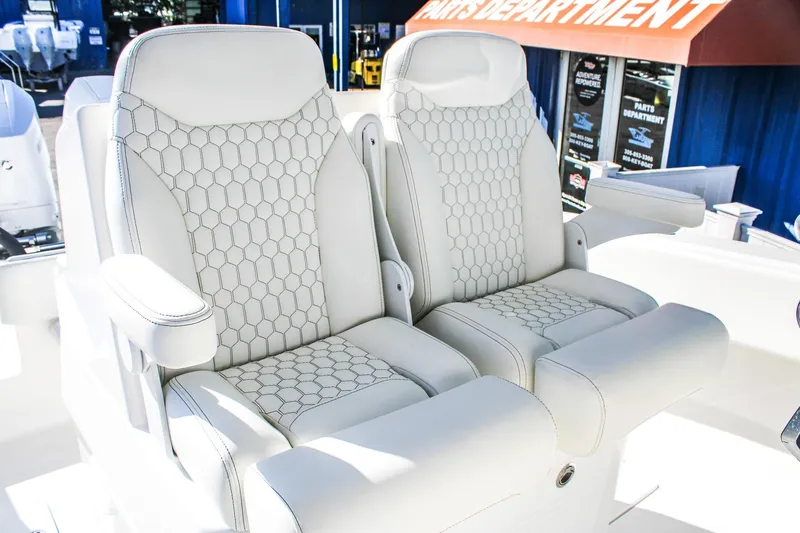  Yacht Photos Pics Luxurious seating on 2026 Invicta 320 CC boat with hexagonal pattern upholstery.