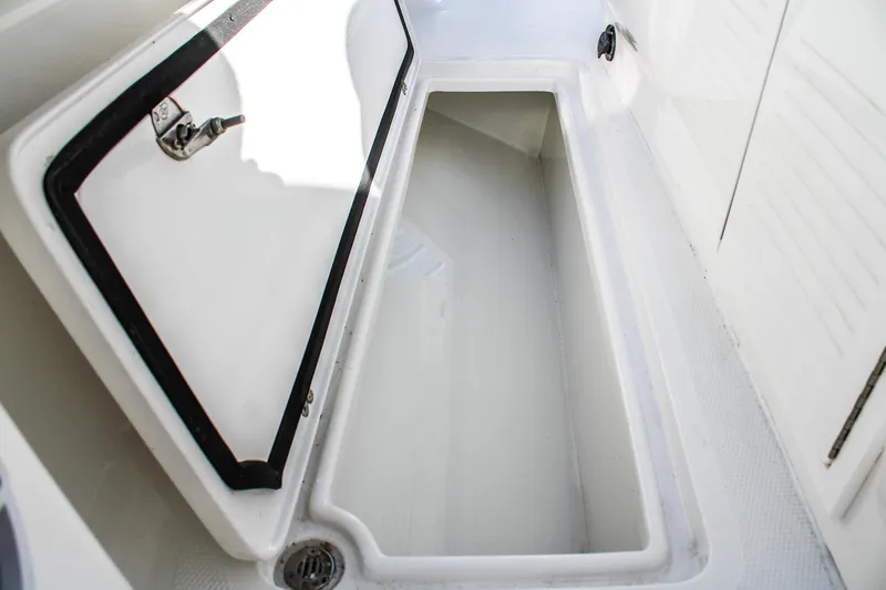  Yacht Photos Pics Open storage compartment on 2026 Invicta 320 CC boat, showcasing interior space.