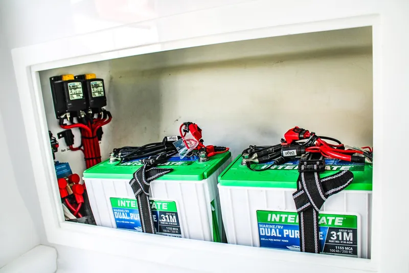  Yacht Photos Pics Battery compartment of 2026 Invicta 320 CC boat with dual-purpose marine batteries.