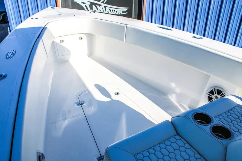  Yacht Photos Pics 2026 Invicta 320 CC boat interior with seating and cup holders, showcasing modern design.