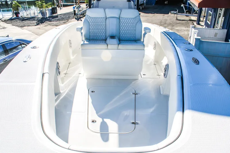  Yacht Photos Pics 2026 Invicta 320 CC boat interior with white seating and spacious deck.