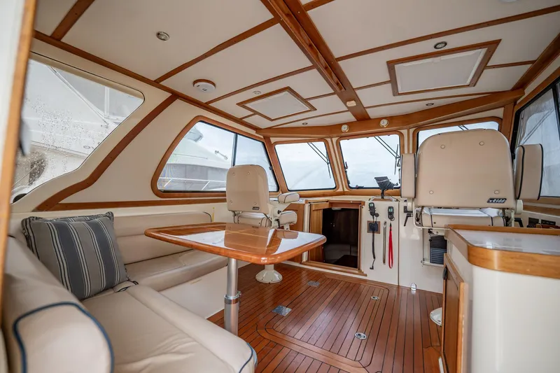 Moondance Yacht Photos Pics Interior of 2006 Sabre 42 Express yacht with elegant wood finish and seating area.