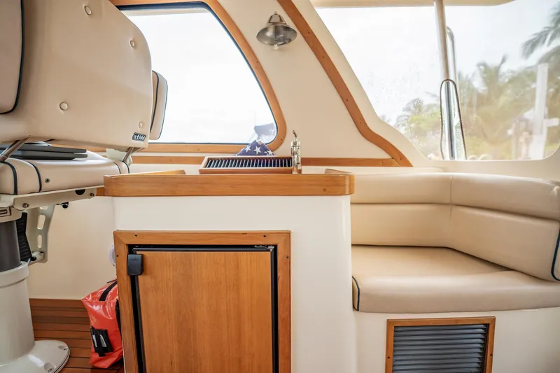 Moondance Yacht Photos Pics Interior of 2006 Sabre 42 Express yacht with seating and wooden cabinetry.