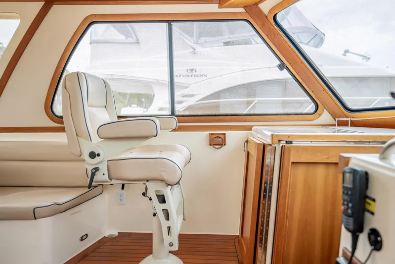 Moondance Yacht Photos Pics Interior of 2006 Sabre 42 Express yacht with leather seating and wooden cabinetry.