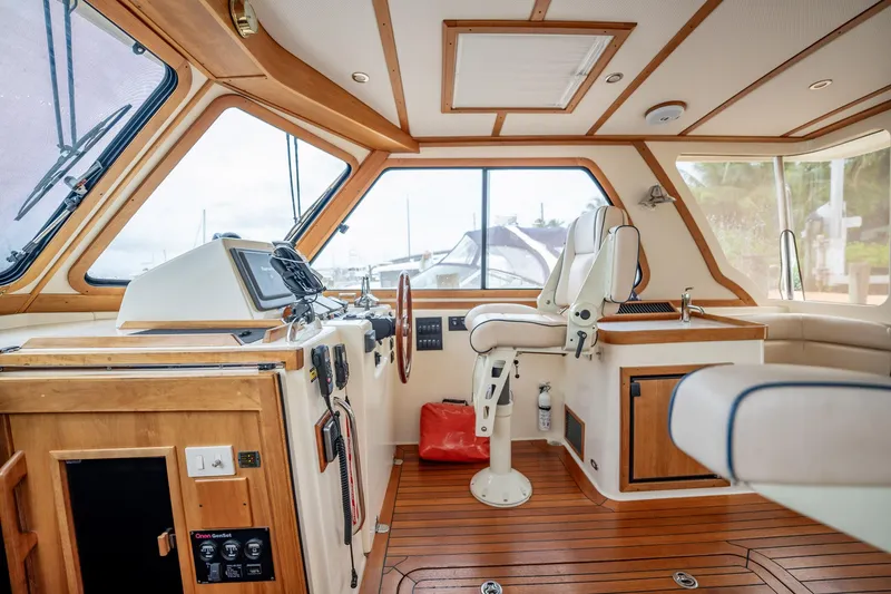 Moondance Yacht Photos Pics Interior of 2006 Sabre 42 Express yacht with wooden accents and modern controls.