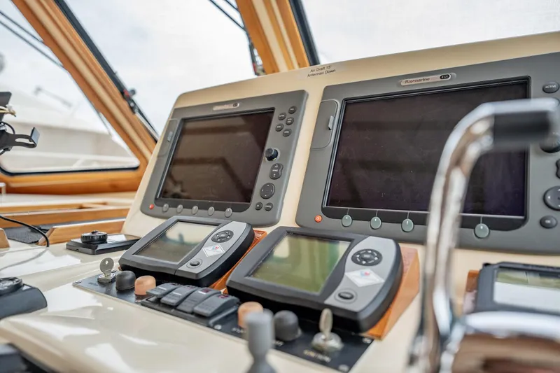 Moondance Yacht Photos Pics Control panel of 2006 Sabre 42 Express yacht with navigation screens and controls.