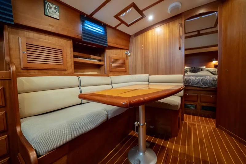 Moondance Yacht Photos Pics Interior of 2006 Sabre 42 Express yacht with wooden finishes and cozy seating area.