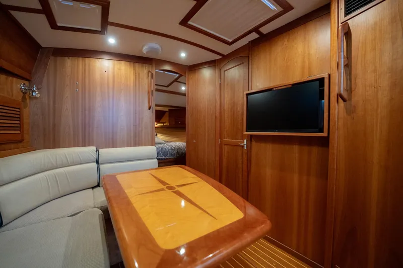 Moondance Yacht Photos Pics Luxurious 2006 Sabre 42 Express yacht interior with wood finish and cozy seating area.