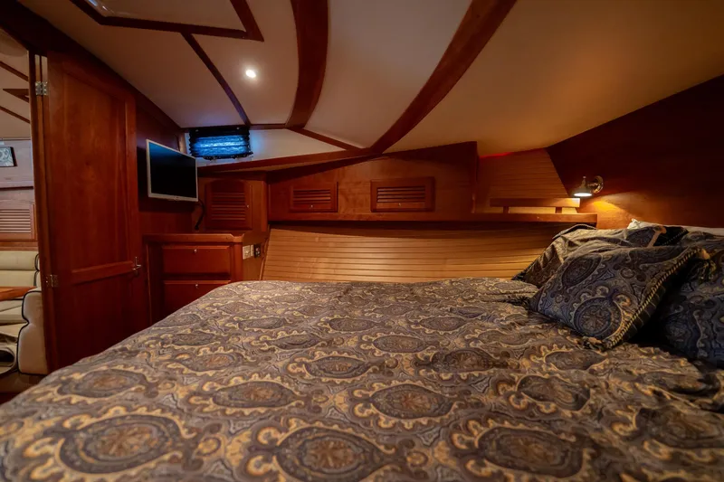 Moondance Yacht Photos Pics Luxurious cabin interior of 2006 Sabre 42 Express yacht with elegant bedding and wood finish.