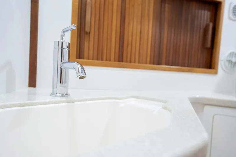 Moondance Yacht Photos Pics Chrome faucet and sink in 2006 Sabre 42 Express yacht bathroom.