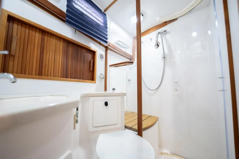 Moondance Yacht Photos Pics 2006 Sabre 42 Express yacht bathroom with wooden accents and modern shower.