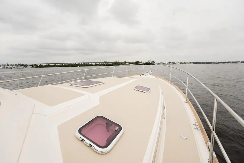 Moondance Yacht Photos Pics 2006 Sabre 42 Express yacht deck with hatches, cruising on a cloudy day.