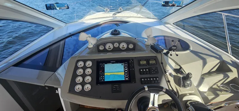 Mambo Italiano Yacht Photos Pics Cockpit view of 2015 Beneteau 38 Gran Tourismo yacht with navigation controls.