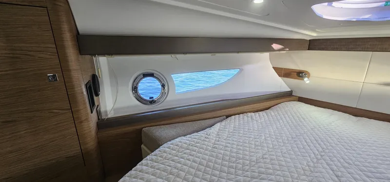 Mambo Italiano Yacht Photos Pics Luxurious cabin interior of 2015 Beneteau 38 Gran Tourismo yacht with ocean view.