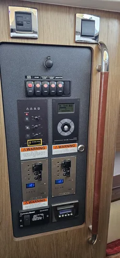 Mambo Italiano Yacht Photos Pics Control panel of a 2015 Beneteau 38 Gran Tourismo yacht with warning labels.