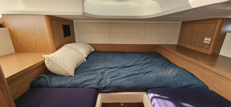 Mambo Italiano Yacht Photos Pics Cozy cabin interior of 2015 Beneteau 38 Gran Tourismo with comfortable bedding.