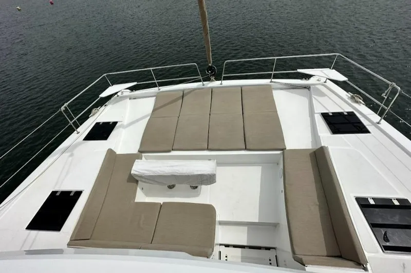  Yacht Photos Pics Bali 4.6 yacht deck with cushioned seating, 2021 model, on calm water.