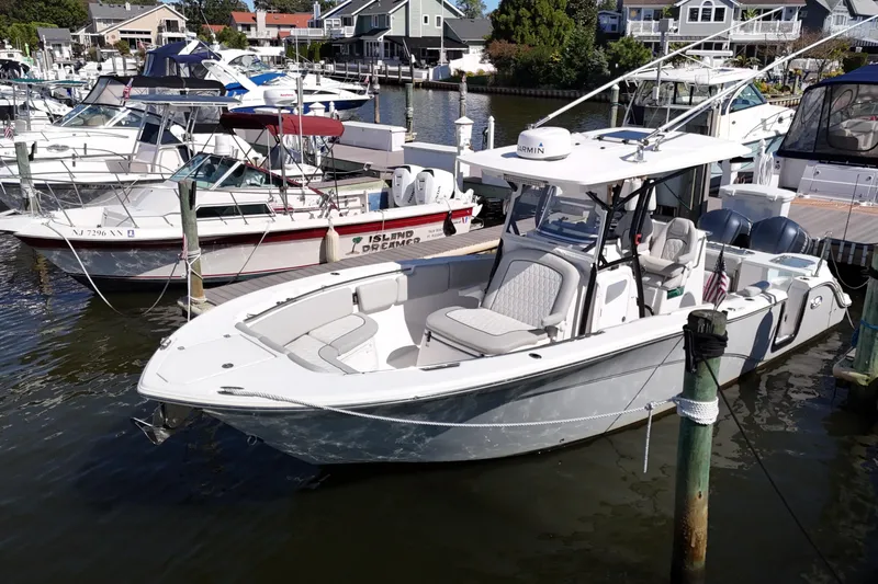  Yacht Photos Pics 2021 Sea Fox 288 Commander boat docked in a marina, surrounded by other vessels.