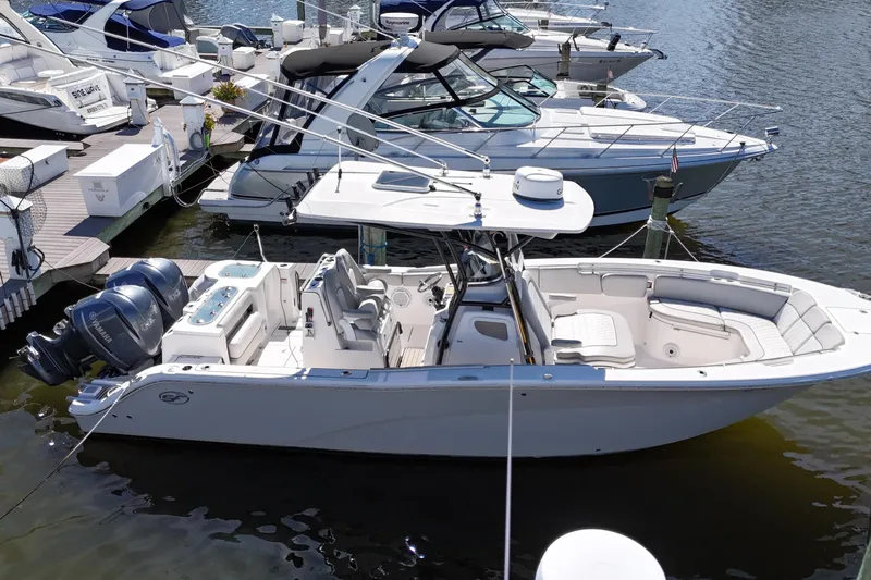  Yacht Photos Pics 2021 Sea Fox 288 Commander boat docked, featuring dual engines and spacious seating.