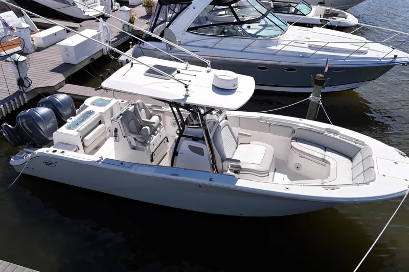  Yacht Photos Pics 2021 Sea Fox 288 Commander boat docked, featuring dual engines and spacious seating.