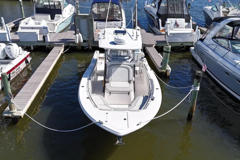  Yacht Photos Pics 2021 Sea Fox 288 Commander docked at marina, surrounded by other boats.