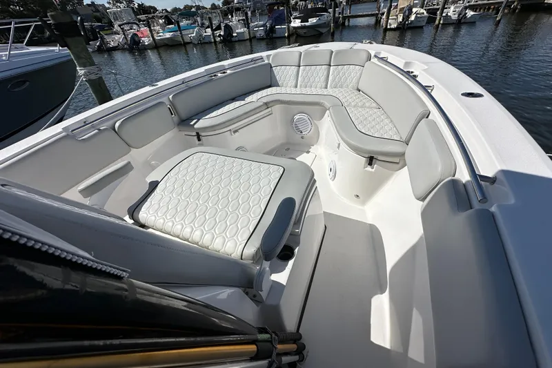  Yacht Photos Pics 2021 Sea Fox 288 Commander boat interior with cushioned seating and harbor view.