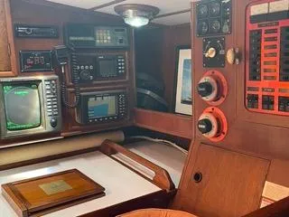  Yacht Photos Pics Navigation station of a 1984 Tayana 55 sailboat with electronic equipment.