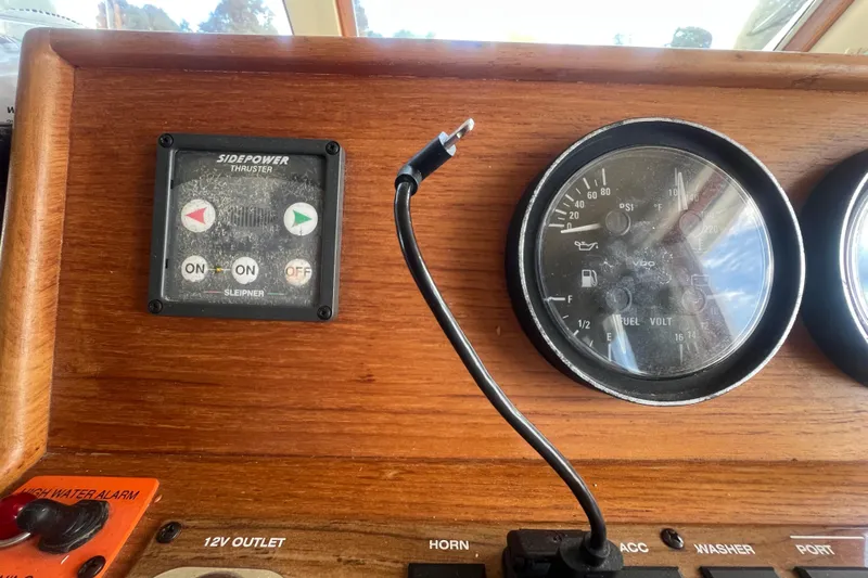 Beryl W Yacht Photos Pics Control panel of a 2001 Mainship 390 Trawler with gauges and thruster controls.