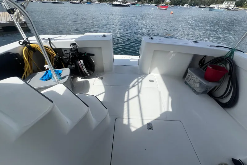 Beryl W Yacht Photos Pics 2001 Mainship 390 Trawler deck with equipment, docked in a scenic marina.