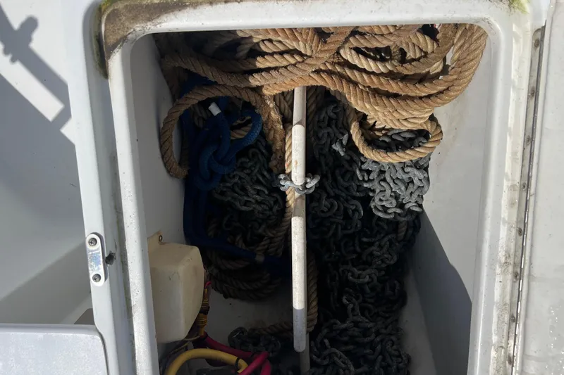 Beryl W Yacht Photos Pics Anchor locker with ropes and chains on a 2001 Mainship 390 Trawler.