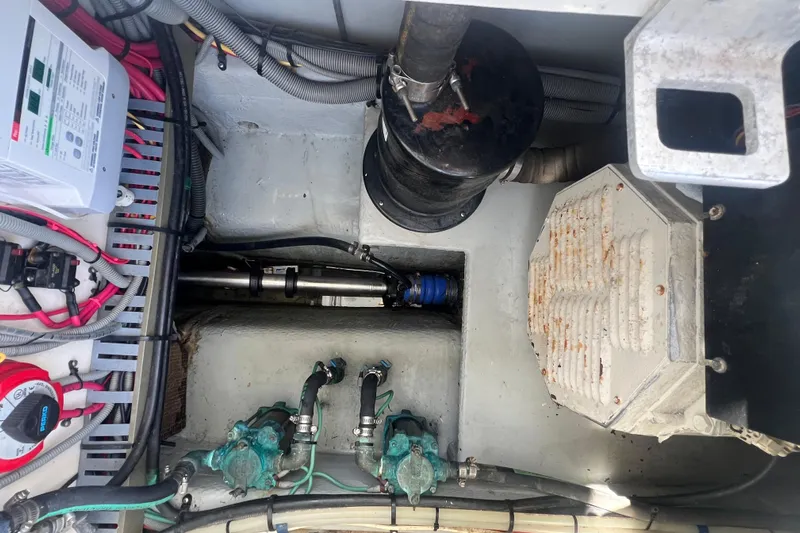 Beryl W Yacht Photos Pics Engine compartment of a 2001 Mainship 390 Trawler with visible wiring and components.