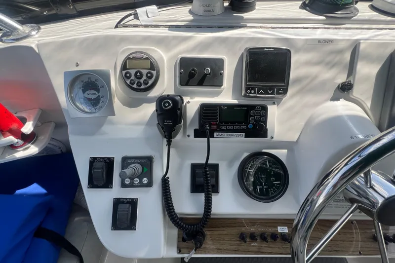 Beryl W Yacht Photos Pics Control panel of a 2001 Mainship 390 Trawler with navigation and communication equipment.