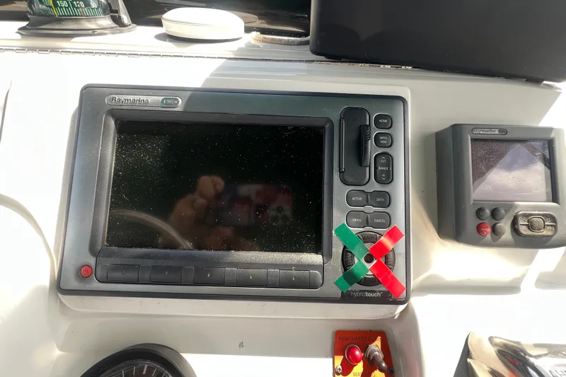 Beryl W Yacht Photos Pics 2001 Mainship 390 Trawler dashboard with Raymarine navigation system and controls.