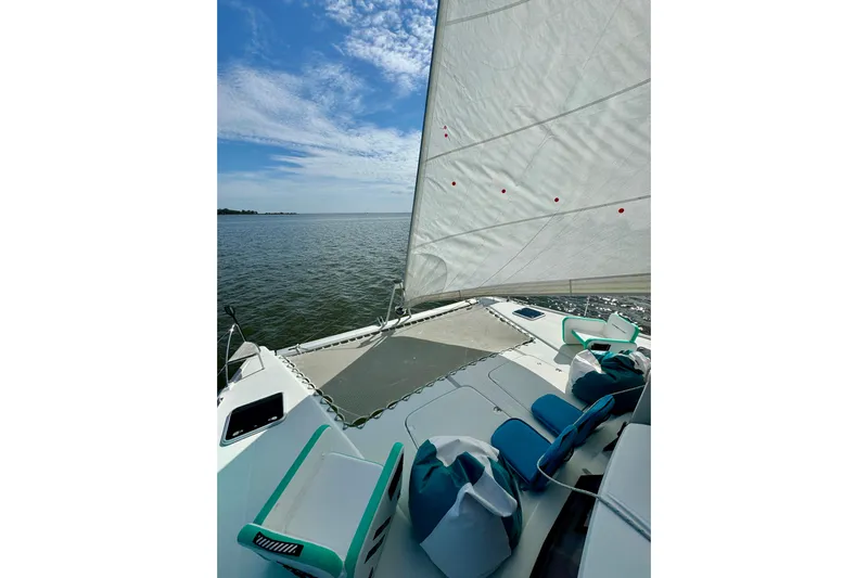 Sweet And Salty Yacht Photos Pics 2018 Fountaine Pajot Helia 44 Evolution sailing on open water under a clear sky.