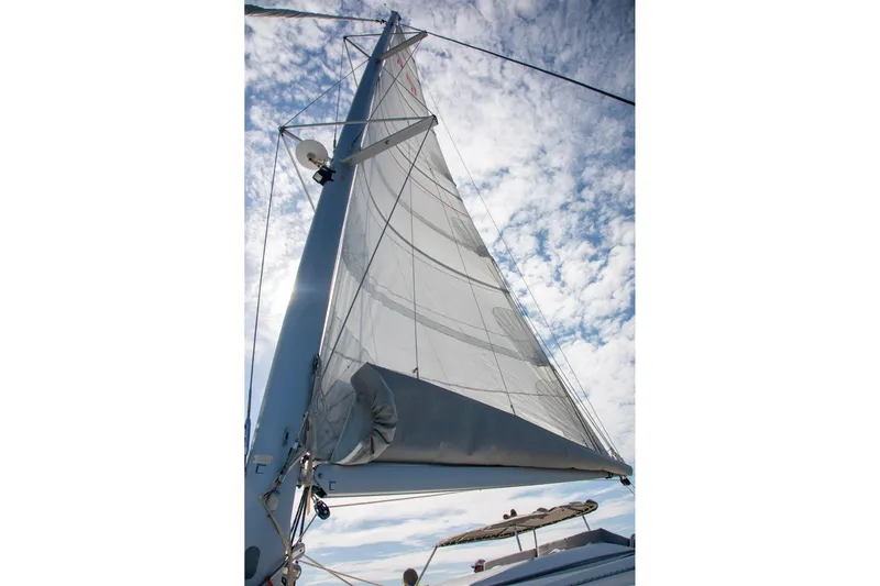 Sweet And Salty Yacht Photos Pics Sail of 2018 Fountaine Pajot Helia 44 Evolution against a cloudy sky.