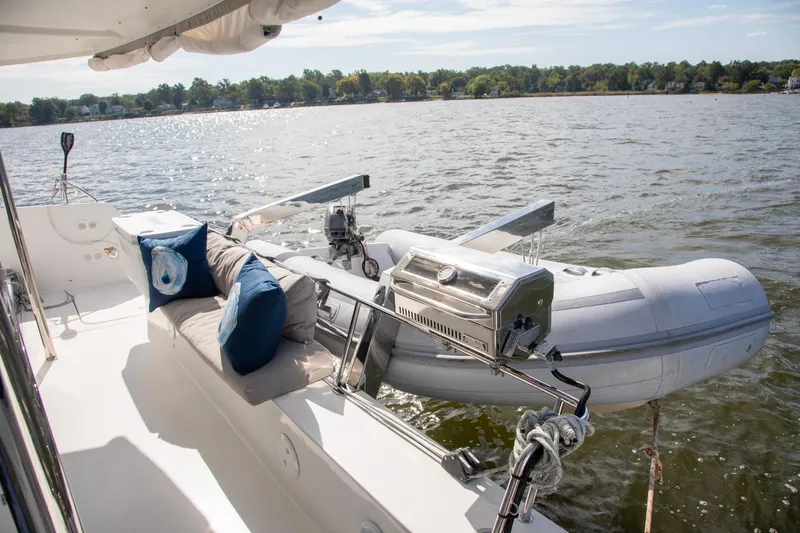 Sweet And Salty Yacht Photos Pics 2018 Fountaine Pajot Helia 44 Evolution yacht with dinghy and outdoor seating.