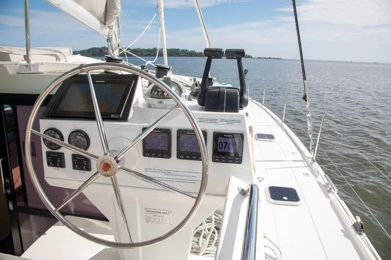 Sweet And Salty Yacht Photos Pics Helm of 2018 Fountaine Pajot Helia 44 Evolution catamaran with navigation instruments.