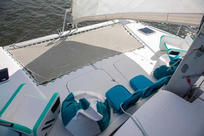 Sweet And Salty Yacht Photos Pics 2018 Fountaine Pajot Helia 44 Evolution catamaran deck with seating and netting.