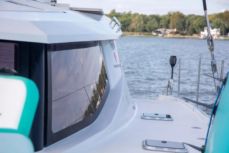 Sweet And Salty Yacht Photos Pics 2018 Fountaine Pajot Helia 44 Evolution catamaran on serene water, showcasing sleek design.