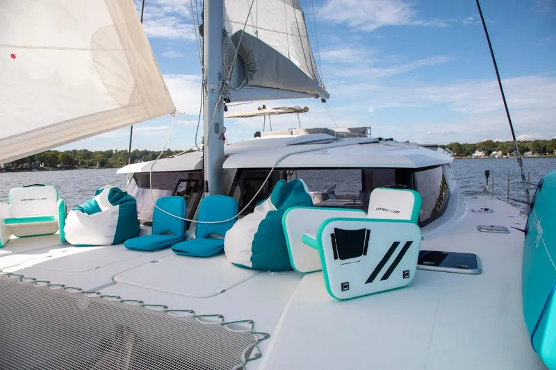 Sweet And Salty Yacht Photos Pics 2018 Fountaine Pajot Helia 44 Evolution catamaran with turquoise seating on deck.