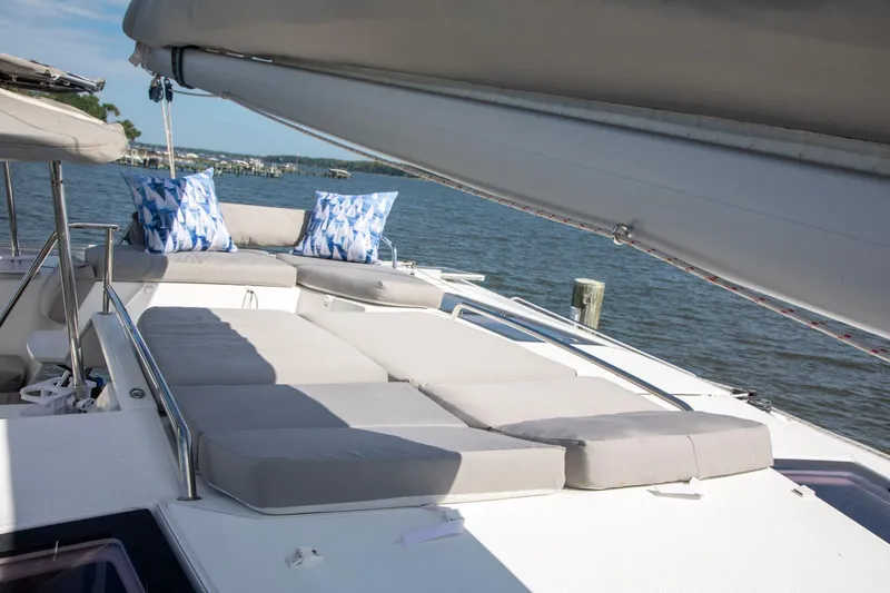Sweet And Salty Yacht Photos Pics Luxurious deck of 2018 Fountaine Pajot Helia 44 Evolution catamaran with cushions and scenic view.