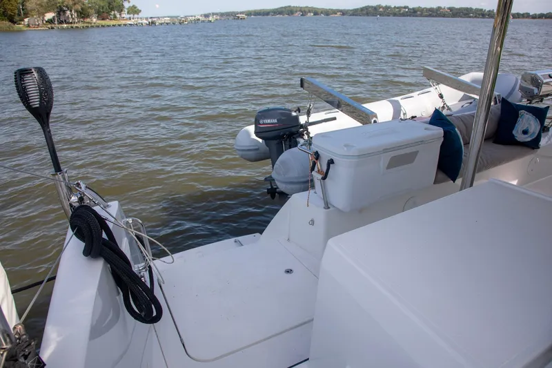 Sweet And Salty Yacht Photos Pics 2018 Fountaine Pajot Helia 44 Evolution catamaran with Yamaha outboard motor on calm water.