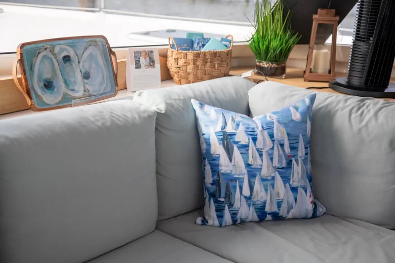 Sweet And Salty Yacht Photos Pics Cozy interior of 2018 Fountaine Pajot Helia 44 Evolution with nautical-themed pillow.